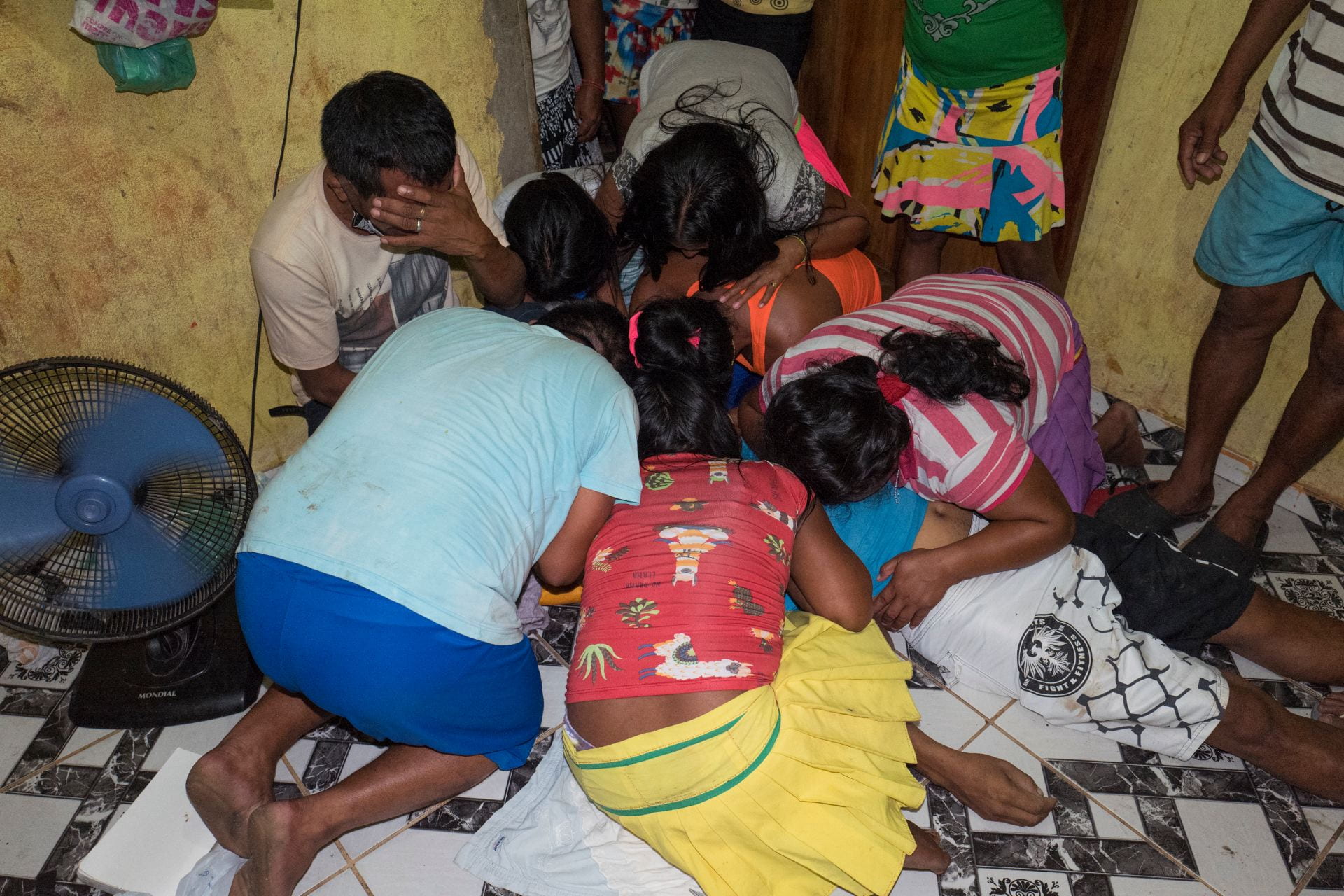 Relatives mourn the death of José Alirio, 45, who died of Covid-19 a few hours ago in a room of a community of about 150 Warao Indigenous refugees in Outeiro, a district of Belem do Pará, Brazilian Amazon. This is the fifht death by COVID19 withing the Warao people of Belém in the past month, including three children. More than xxx indigenous died during the Coronavirus outbreak in Brazil.